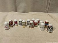 Group shot of all ceramic thimbles showing variety of motifs and quantity