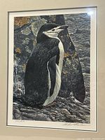 Close view of print showing penguin image, mat and numbering 403/810