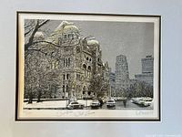 Full view of matted etching with building and cars