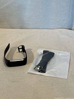 smart watch with plum strap and sealed black strap