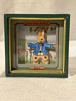 Front view showing Little Grey Rabbit hare figure and frame