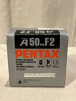 Retail box front showing model A 50 mm F2 and Pentax branding