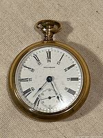 Front view showing dial, hands, case condition