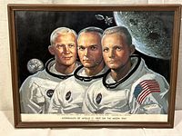 Front view showing artwork, astronauts, title caption, frame