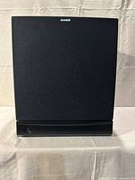 Front view of Sony subwoofer with grille and port