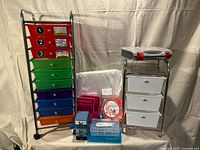 Overall lot showing both rolling carts, baskets, parts cases and parts sorter drawers