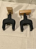 Front view of both Hercules wall hangers showing yokes and wooden blocks