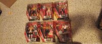 Front view of six sealed WWE Elite figures