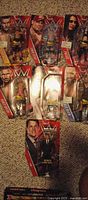 Front view of all seven carded WWE figures