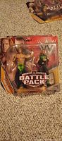 Front view of sealed WWE Battle Pack showing both figures and logo