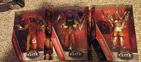 Front view of all three sealed Elite Collection figures in boxes