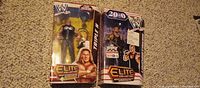 Front view of both sealed WWE Elite figures in boxes