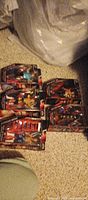 Six sealed WWE Network Spotlight action figures arranged on floor