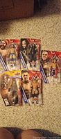 Five sealed WWE SummerSlam figures arranged front view