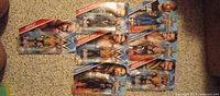 Front view of all seven sealed WrestleMania figures