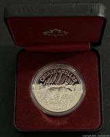 Coin in open red presentation case