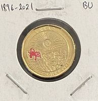 Reverse of 2021 colour Klondike loonie showing design and red pickaxe