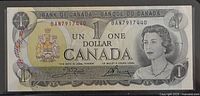 Obverse of 1973 Canadian $1 note showing Queen Elizabeth II and serial BAN7917440