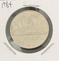 Reverse of 1984 Canada dollar showing Voyageur design in 2×2 flip