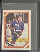 Front of 1986-87 O-Pee-Chee Wayne Gretzky sticker card in protective sleeve