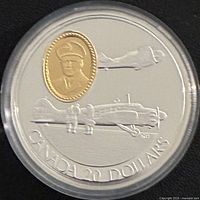 Reverse showing aircraft engravings and gold-plated cameo, denomination visible