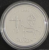 Reverse side showing petroglyph figure, wheel, dog, date 1999