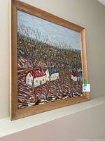 Front view of framed oil landscape painting