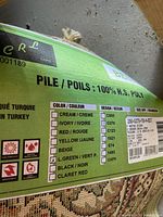 Manufacturer label showing brand, material 100% H.S. poly, color ticked as green, origin Turkey
