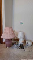 All four table lamps with cords and shades plus three teddy bear figurines