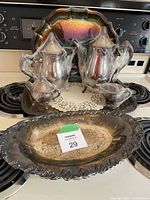 Entire lot showing tea and coffee pieces on tray with oval dish in front