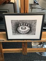 Frontal view of framed Dean Joanisse print on easel