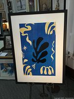 Full view of framed Matisse print on easel