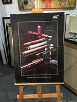 Full view of framed Montblanc poster on easel