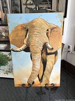 Full view of oil painting on easel