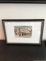 Full view of framed watercolour on sofa back