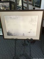 Full view of framed Val Sewell watercolour on easel