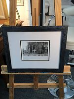 Front view of framed photograph on easel