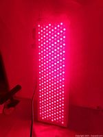 Panel front illuminated showing active red LEDs