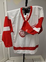 Front view of jersey on hanger