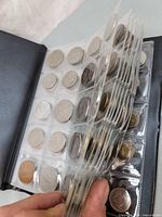 Side view of binder showing multiple filled pocket pages