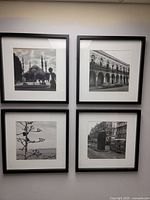 All four framed photographs displayed together on wall
