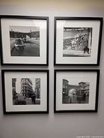 All four framed photographs on wall