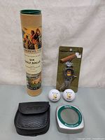 Exelys BreakMaster reader, St Andrews golf balls, cigar clip | Maxsold