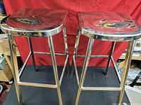 Pair of chrome bar stools full view