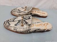 Top and side view of both shoes showing pattern and hardware