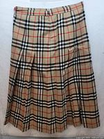 Full front view of pleated Nova Check skirt