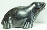 Left profile of soapstone seal showing flipper detail and finish