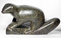Left side view of mottled soapstone otter carving