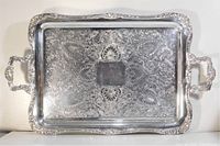 Top view showing ornate floral engraving, scalloped rim and handles