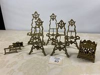 All items grouped: five easels, three place card holders, one floral holder